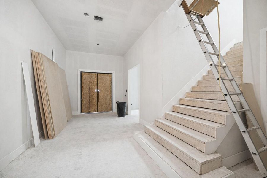 Grand entrance of this Arch Angelo new construction, showcasing a stunning foyer with soaring high ceilings and an abundance of natural light. The expansive interior features a custom staircase with oversized wood treads and sleek modern lines, exemplifying high-end contemporary design. This open-concept entryway highlights the premium craftsmanship and meticulous attention to detail found throughout the home. Grand entrance of this Arch Angelo new construction, showcasing a stunning foyer with soaring high ceilings and an abundance of natural light. The expansive interior features a custom staircase with oversized wood treads and sleek modern lines, exemplifying high-end contemporary design. This open-concept entryway highlights the premium craftsmanship and meticulous attention to detail found throughout the home.