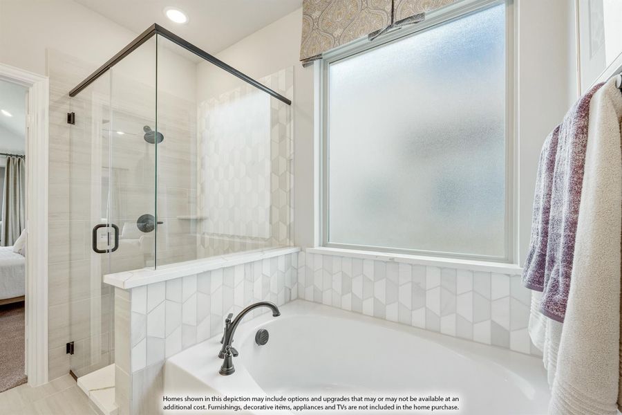 Bathroom with soaking tub, white geometric tile surround, and glass-enclosed walk-in shower Bathroom with soaking tub, white geometric tile surround, and glass-enclosed walk-in shower