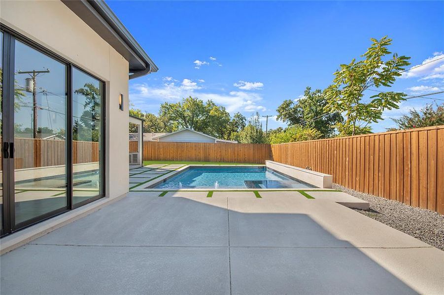 View of pool featuring a patio and a fenced backyard