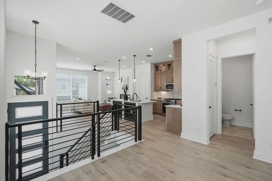 Furnished interior view inside a new home in Centero at Stone Oak, San Antonio (Image 19).