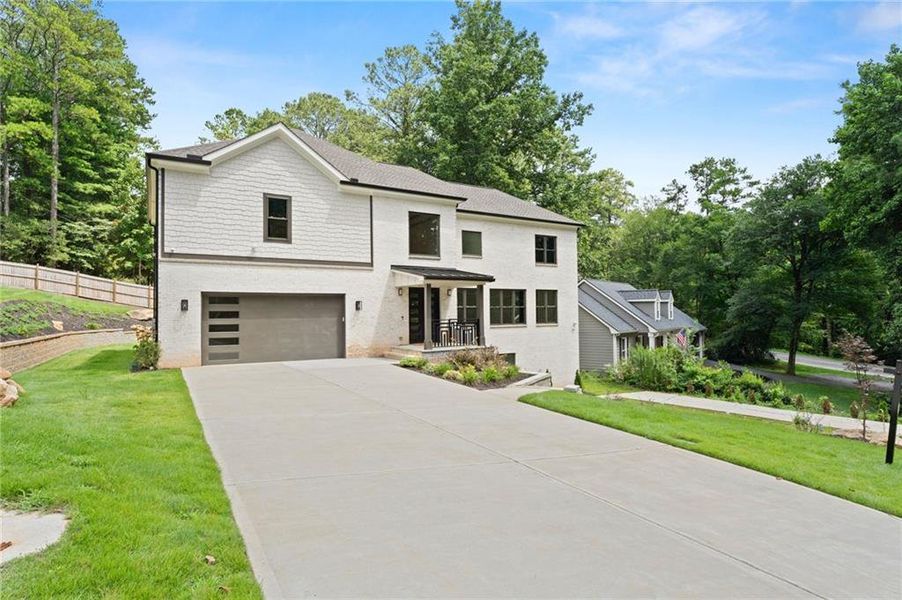 Front exterior of a new home in , Roswell, GA, highlighting curb appeal (Image 2). Front exterior of a new home in , Roswell, GA, highlighting curb appeal (Image 2).