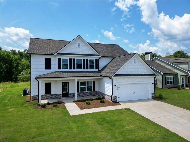 Front exterior of a new home in Harmony Farms, Eatonton, GA, highlighting curb appeal (Image 25).