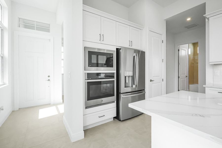 Furnished interior view inside a new home in Rivella, Port St. Lucie (Image 5).
