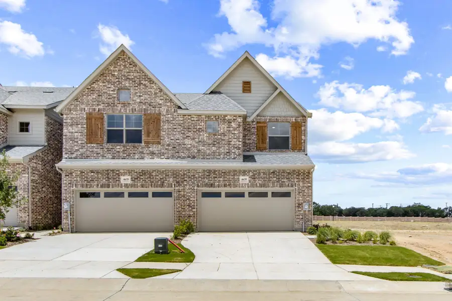 Front exterior of a new home in Wildridge, Oak Point, TX, highlighting curb appeal (Image 2). Front exterior of a new home in Wildridge, Oak Point, TX, highlighting curb appeal (Image 2).