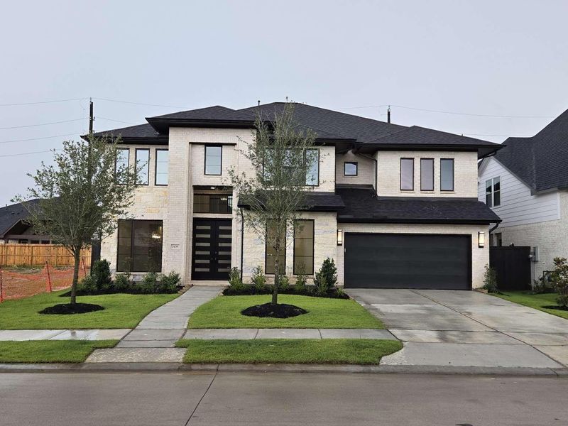 Front exterior of a new home in , Richmond, TX, highlighting curb appeal (Image 2).