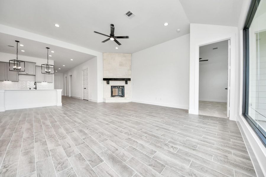 Take another glimpse into the heart of the home with this additional view of the family room—a sprawling space ready to accommodate all your gatherings. Take another glimpse into the heart of the home with this additional view of the family room—a sprawling space ready to accommodate all your gatherings.
