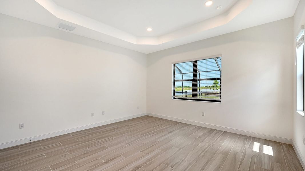 Spacious, unfurnished interior of a new home in Palm Grove Real Estate and Homes for Sale in Lakewood Ranch, FL - Neal Communities, Bradenton (Image 26).