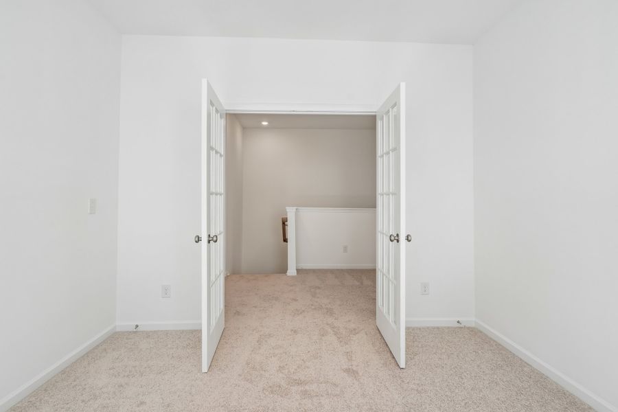 Spacious, unfurnished interior of a new home in Terraces at the Exchange, Indian Land (Image 18).
