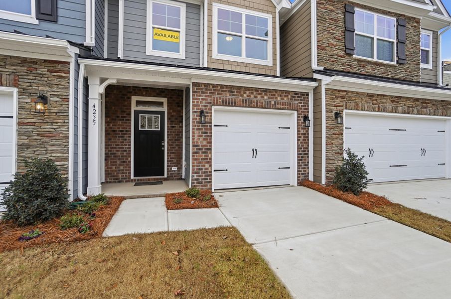 Exterior details and patio area of a home in Harrisburg Village Townhomes, Harrisburg (Image 3).
