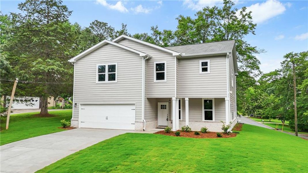 Front exterior of a new home in , Stockbridge, GA, highlighting curb appeal (Image 29).