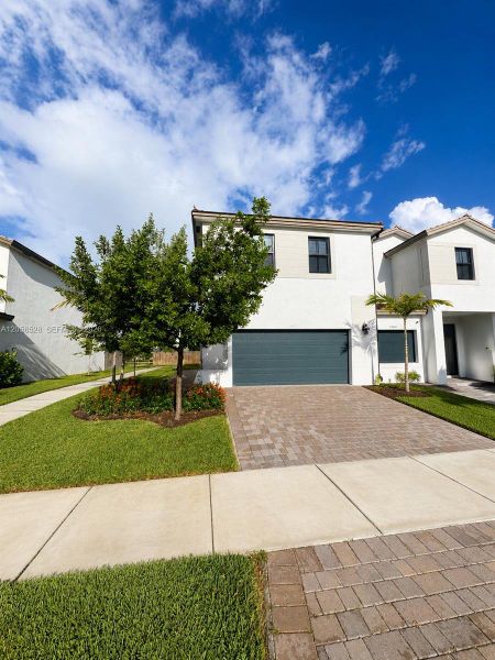 Front exterior of a new home in , Miami, FL, highlighting curb appeal (Image 1). Front exterior of a new home in , Miami, FL, highlighting curb appeal (Image 1).
