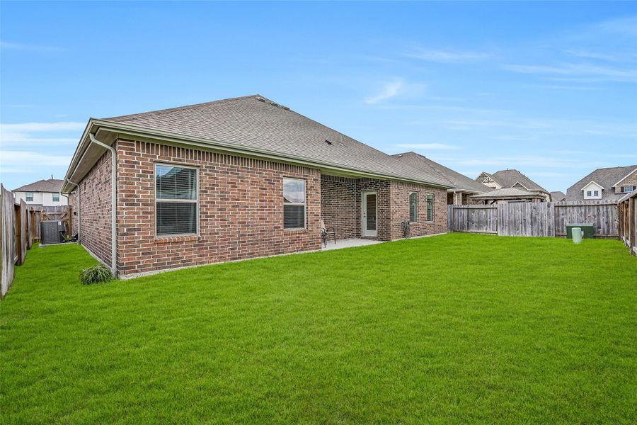 The generously sized fenced backyard provides a broad expanse of level lawn with plenty of room for outdoor recreation, pets, gardening or creating your own personalized backyard retreat. The generously sized fenced backyard provides a broad expanse of level lawn with plenty of room for outdoor recreation, pets, gardening or creating your own personalized backyard retreat.