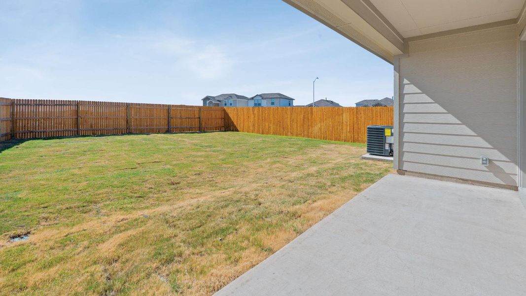 Exterior details and patio area of a home in Prairie Lakes, Buda (Image 23).