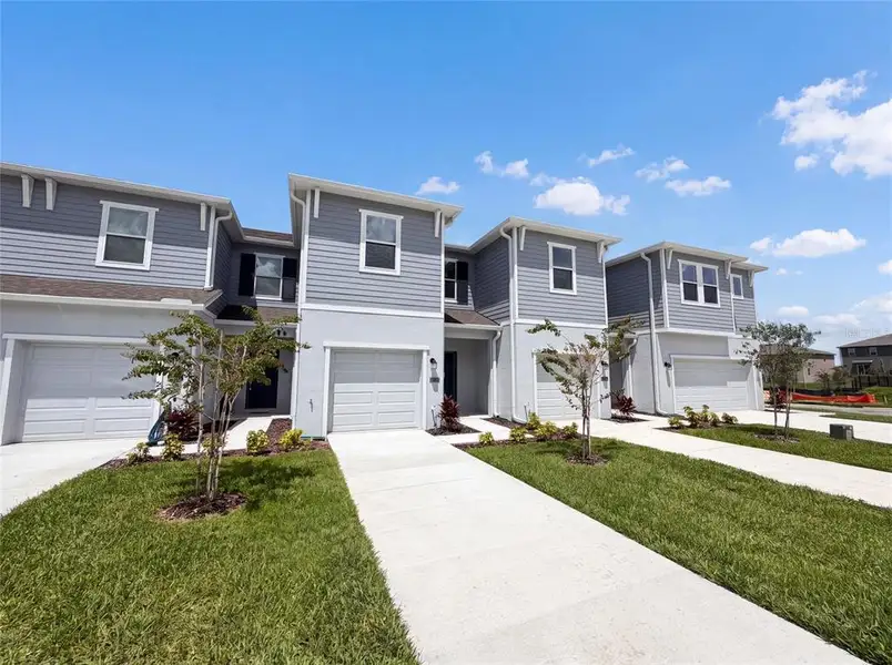 Front exterior of a new home in , Davenport, FL, highlighting curb appeal (Image 1). Front exterior of a new home in , Davenport, FL, highlighting curb appeal (Image 1).