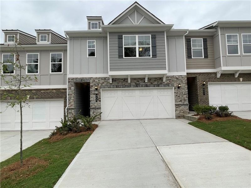 Front exterior of a new home in Porter Reserve, Decatur, GA, highlighting curb appeal (Image 1). Front exterior of a new home in Porter Reserve, Decatur, GA, highlighting curb appeal (Image 1).
