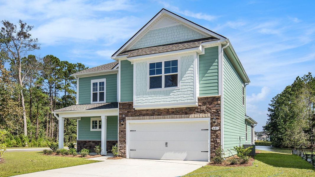 Front exterior of a new home in Heron Pointe, Myrtle Beach, SC, highlighting curb appeal (Image 2). Front exterior of a new home in Heron Pointe, Myrtle Beach, SC, highlighting curb appeal (Image 2).