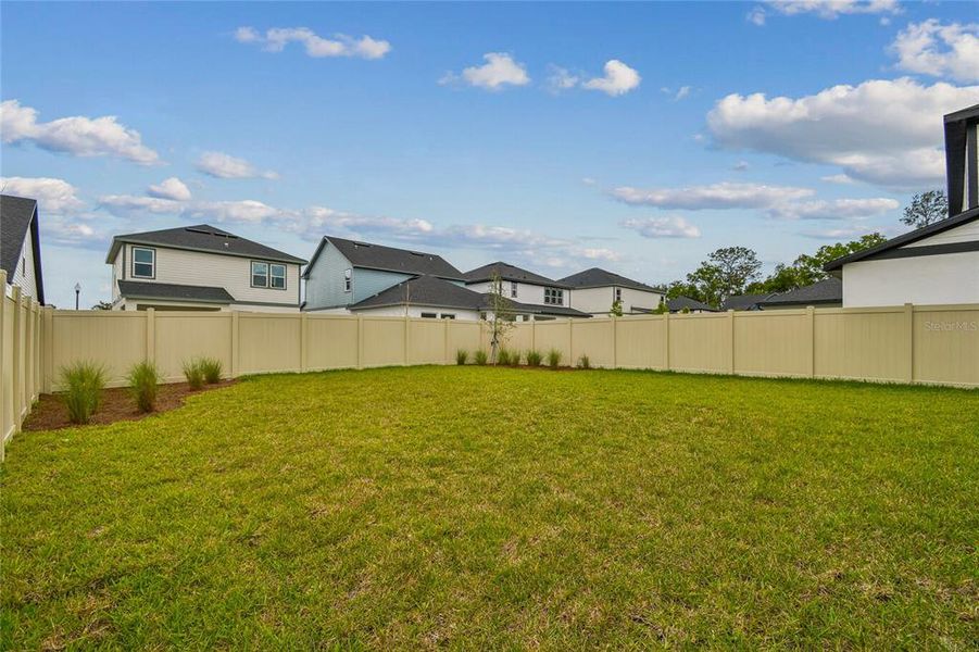Exterior details and patio area of a home in Oakfield at Mount Dora Cottage Series, Mount Dora (Image 21).