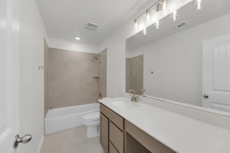 Furnished interior view inside a new home in Mustang Valley, Manor (Image 16).