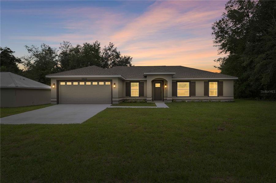 Front exterior of a new home in , Dunnellon, FL, highlighting curb appeal (Image 23).