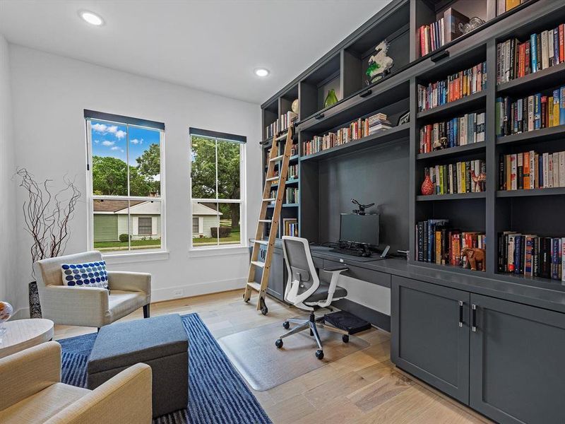 To your right upon entering, you will find this stunning library/office space complete with a built in bookshelf.