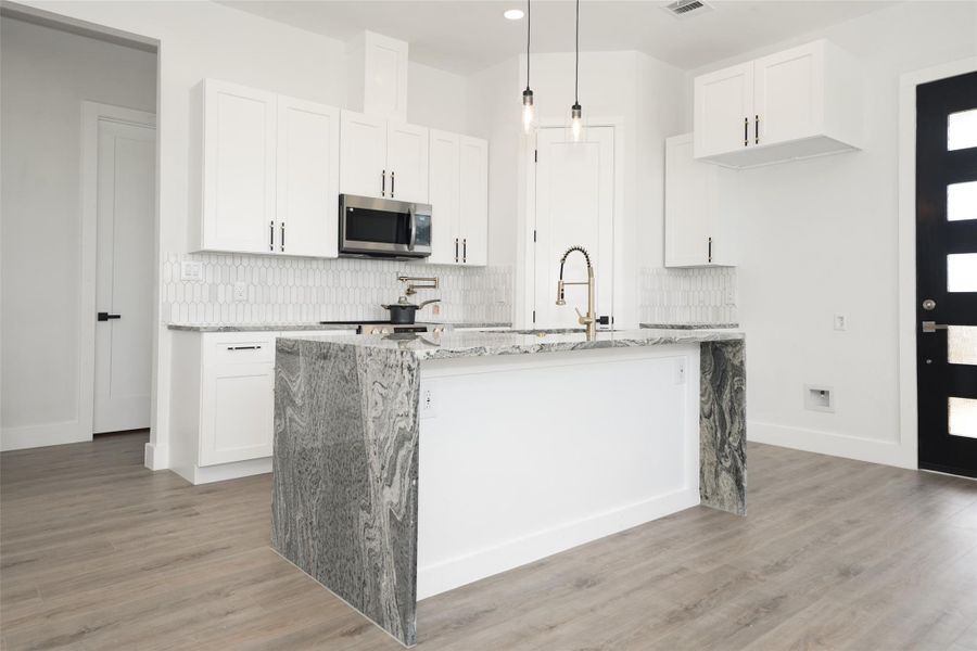 The property is surrounded by open green fields and offers views of a Matagorda Bay. The neighborhood is peaceful with spread out neighboring homes and wide roads.