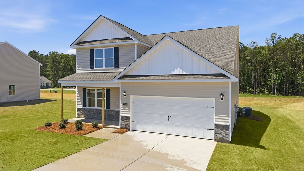 Front exterior of a new home in Beaver Dam Crossing, Bailey, NC, highlighting curb appeal (Image 20). Front exterior of a new home in Beaver Dam Crossing, Bailey, NC, highlighting curb appeal (Image 20).