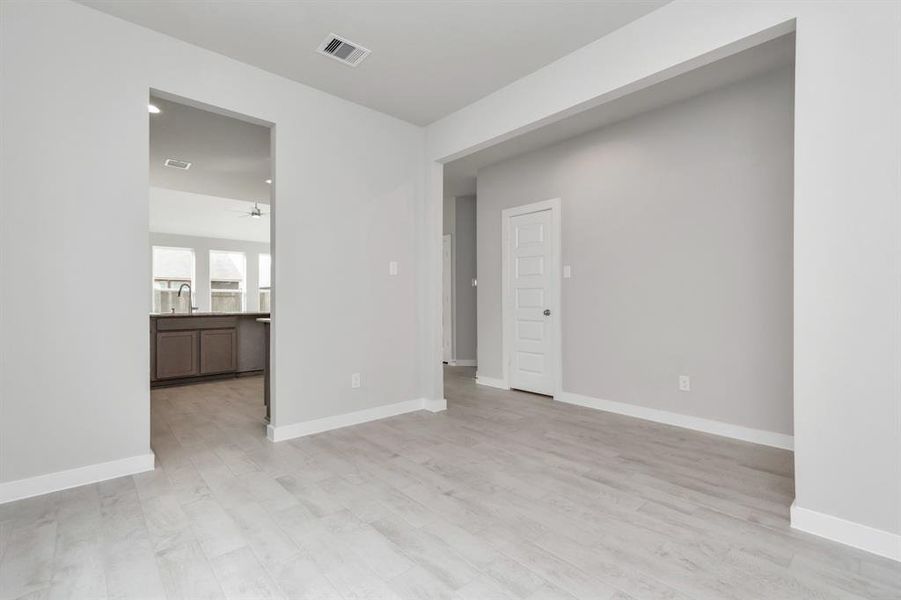 Another view of the dining area. Sample photo of completed home with similar floor plan. Actual colors and selections may vary.