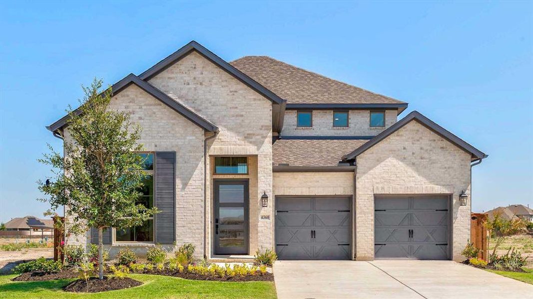 Front exterior of a new home in Mosaic 50', Celina, TX, highlighting curb appeal (Image 1).