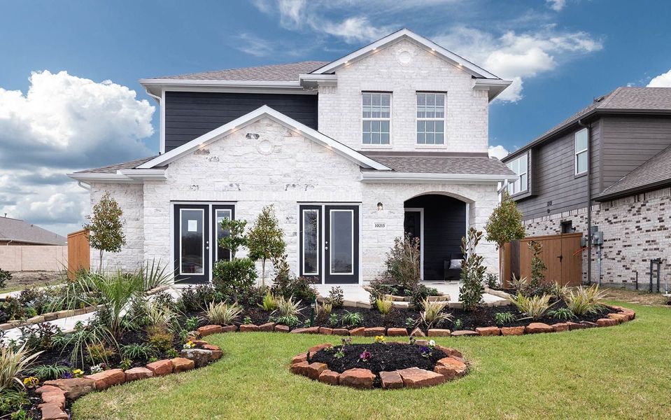 Front exterior of a new home in Lago Mar, Texas City, TX, highlighting curb appeal (Image 2).