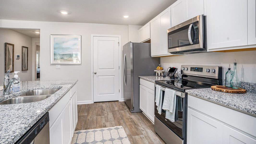Furnished interior view inside a new home in Stanbury Creek, Supply (Image 7).