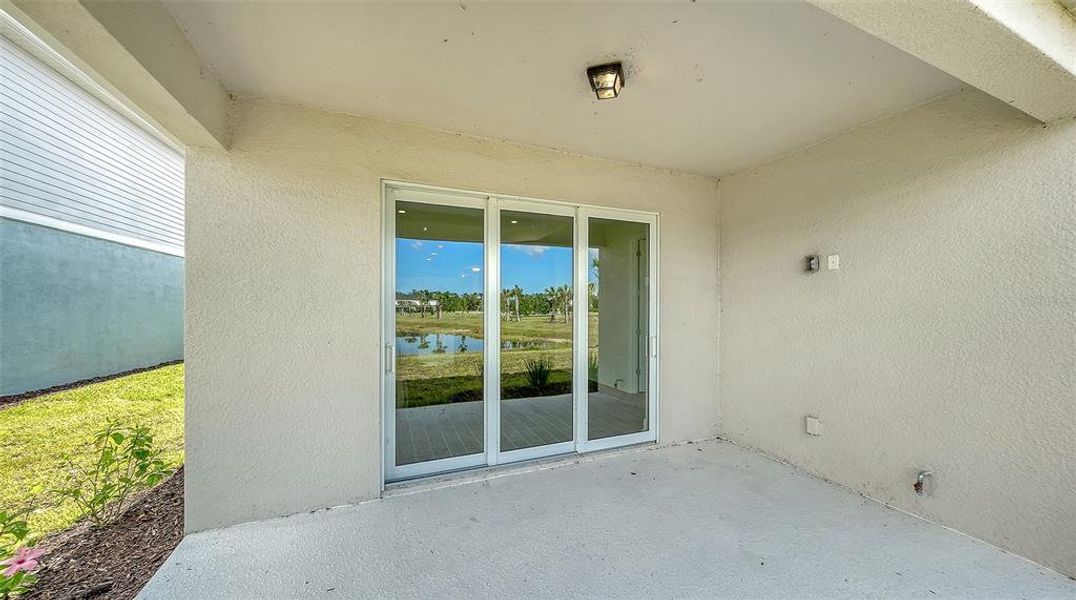 Exterior details and patio area of a home in Grand Park, Sarasota (Image 20).