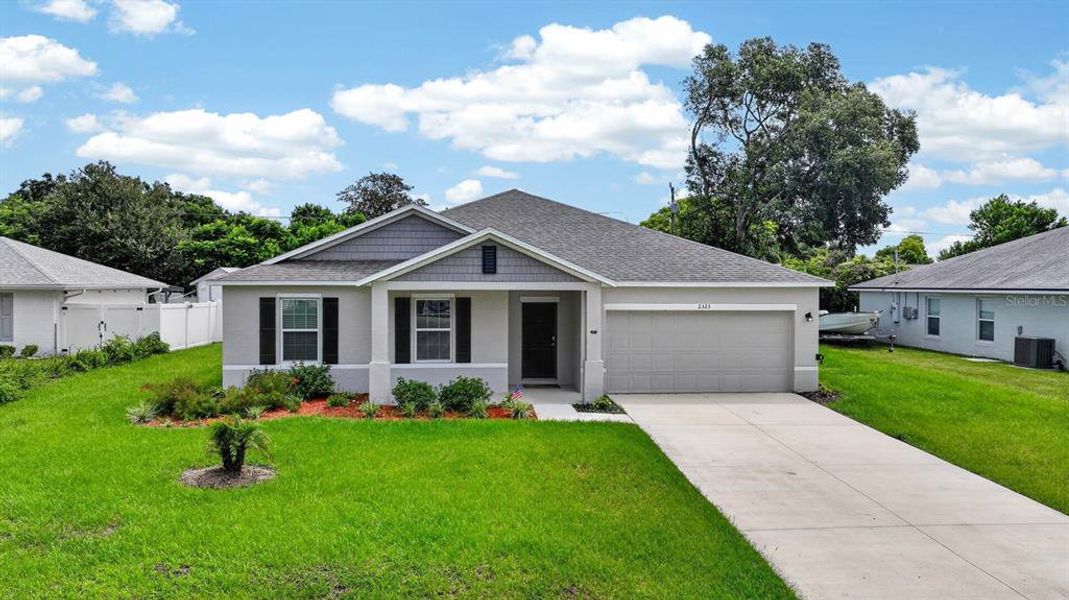 Front exterior of a new home in , Edgewater, FL, highlighting curb appeal (Image 2). Front exterior of a new home in , Edgewater, FL, highlighting curb appeal (Image 2).