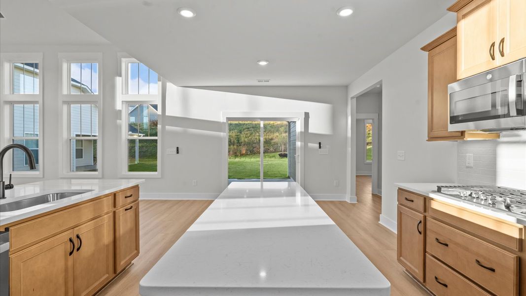 Tasteful kitchen with a streamlined island and modern finishes in a first-class DRB Homes design