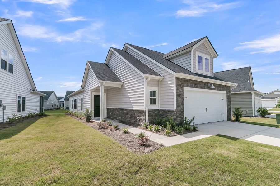 Front exterior of a new home in Horizons at Summers Corner | 55+: The Cottages, Summerville, SC, highlighting curb appeal (Image 24). Front exterior of a new home in Horizons at Summers Corner | 55+: The Cottages, Summerville, SC, highlighting curb appeal (Image 24).