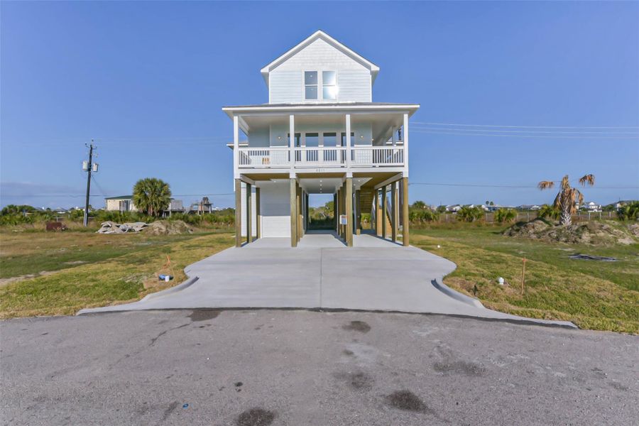 Front exterior of a new home in , Galveston, TX, highlighting curb appeal (Image 27).