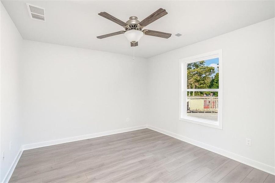 Spacious, unfurnished interior of a new home in The Cottages at East Lanier, Fairburn (Image 9).