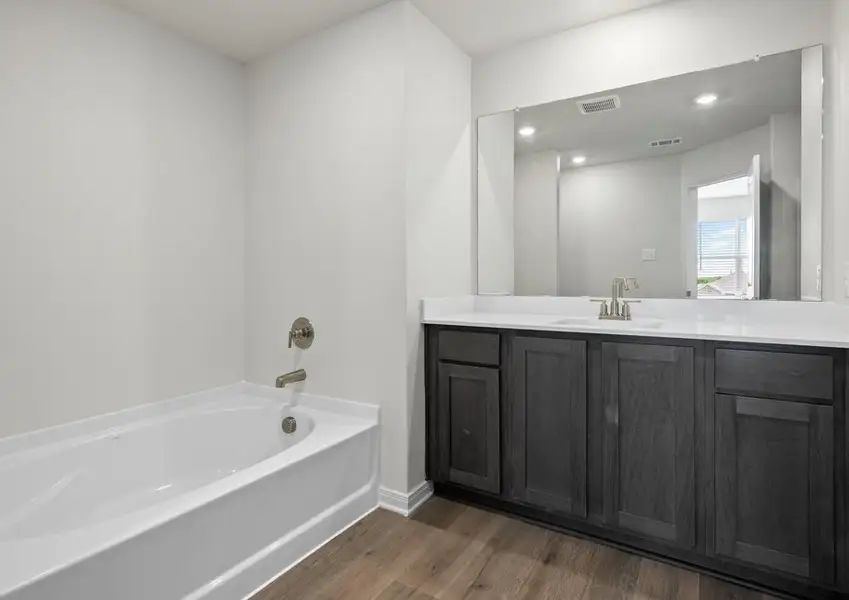 The master bathroom has a garden tub. The master bathroom has a garden tub.