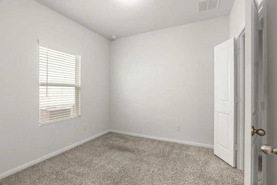 Unfurnished room with carpet and baseboards