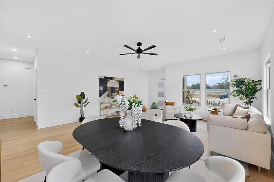 Dining room featuring light wood-type flooring, recessed lighting, and ceiling fan