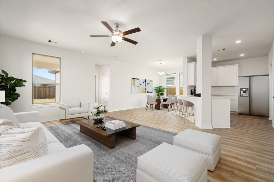 This open-concept layout showcases a bright and airy design with large windows that fill the space with natural light. The modern kitchen seamlessly connects to the dining and living areas, creating a comfortable and functional flow. Neutral tones, recessed lighting, and clean finishes highlight the home's contemporary style. This open-concept layout showcases a bright and airy design with large windows that fill the space with natural light. The modern kitchen seamlessly connects to the dining and living areas, creating a comfortable and functional flow. Neutral tones, recessed lighting, and clean finishes highlight the home's contemporary style.