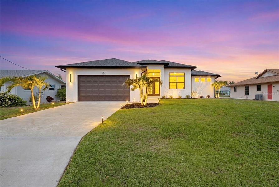Front exterior of a new home in , Port Charlotte, FL, highlighting curb appeal (Image 1). Front exterior of a new home in , Port Charlotte, FL, highlighting curb appeal (Image 1).