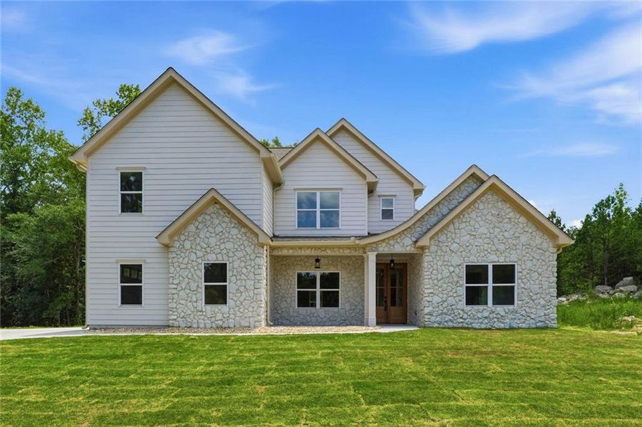 Front exterior of a new home in , Douglasville, GA, highlighting curb appeal (Image 1). Front exterior of a new home in , Douglasville, GA, highlighting curb appeal (Image 1).