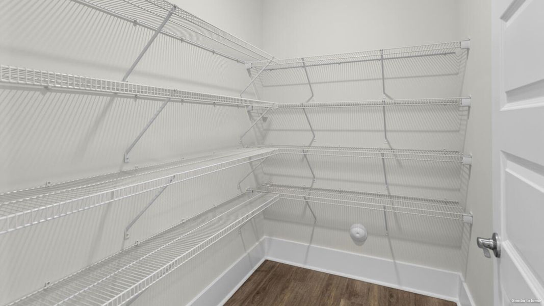 Representative unfurnished interior of a home built from the Harbor Oak by D.R. Horton in The Grove at Blake Farm, Wilmington (Image 18).