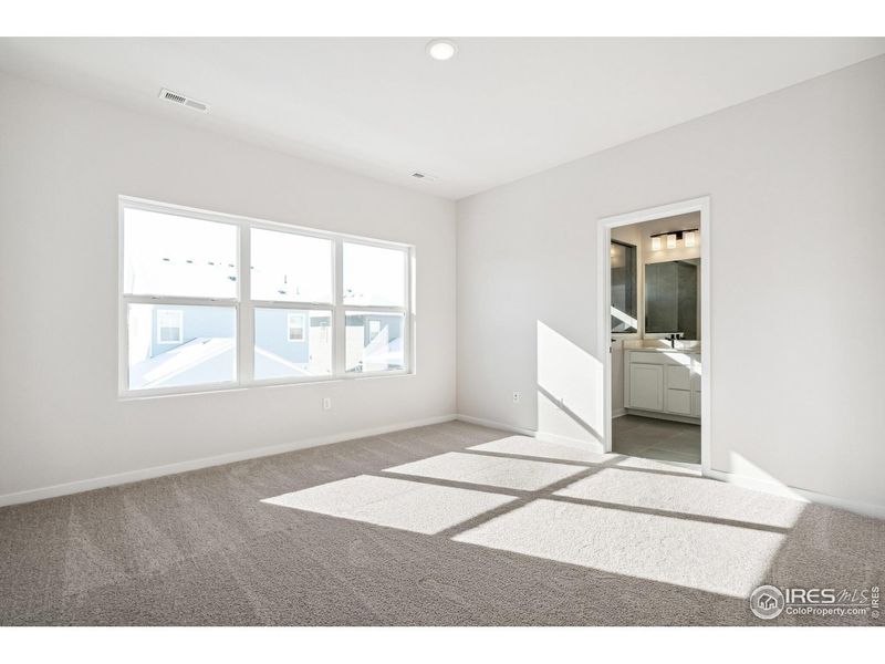 Spacious, unfurnished interior of a new home in Kinston Mainstreet Townhomes, Loveland (Image 27).