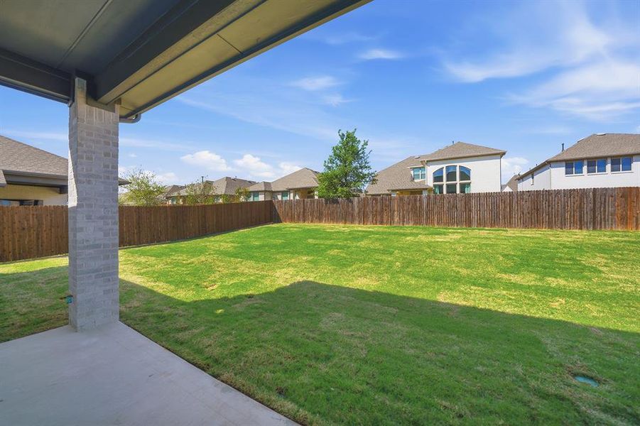 Exterior details and patio area of a home in Tavolo Park, Fort Worth (Image 3).