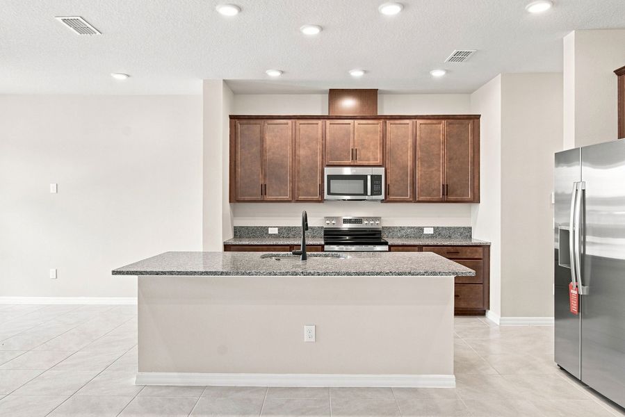 Representative furnished interior of a home built from the The Mcquade by David Weekley Homes in Palmeras at Crossprairie – The Palms Collection, St. Cloud (Image 6).