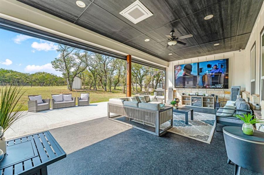 View of patio featuring an outdoor hangout area, a ceiling fan, and a storage shed View of patio featuring an outdoor hangout area, a ceiling fan, and a storage shed