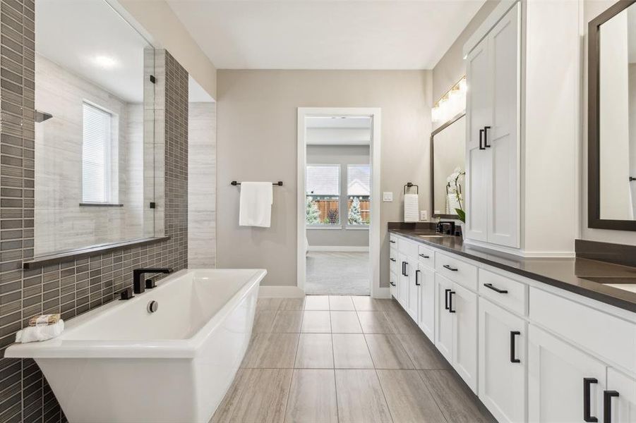 Bathroom featuring vanity, separate shower and tub, tile patterned flooring, and plenty of natural light