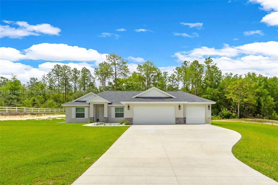 Front exterior of a new home in , Ocala, FL, highlighting curb appeal (Image 1). Front exterior of a new home in , Ocala, FL, highlighting curb appeal (Image 1).