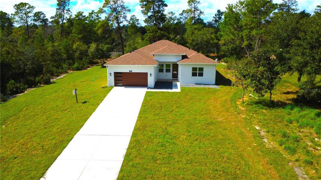 Front exterior of a new home in , Eustis, FL, highlighting curb appeal (Image 31).